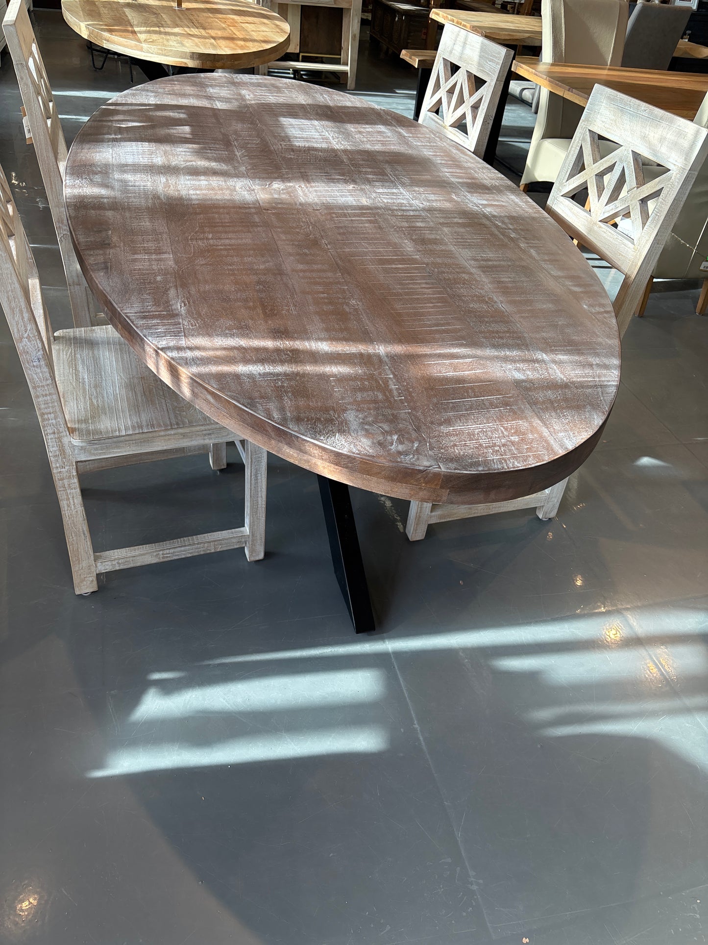 Cartier 91 inch Weathered Oval Mango wood dining table