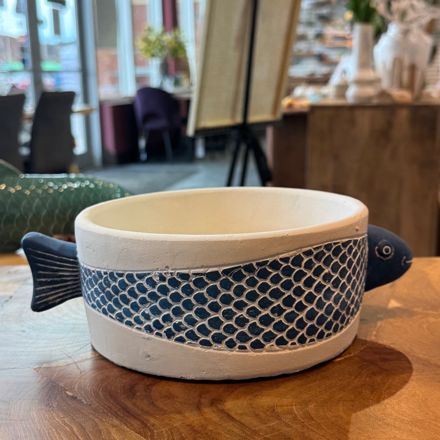 Low pottery container with blue fish