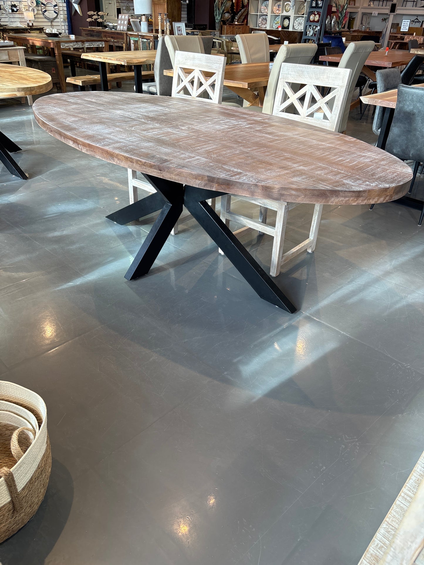Cartier 91 inch Weathered Oval Mango wood dining table