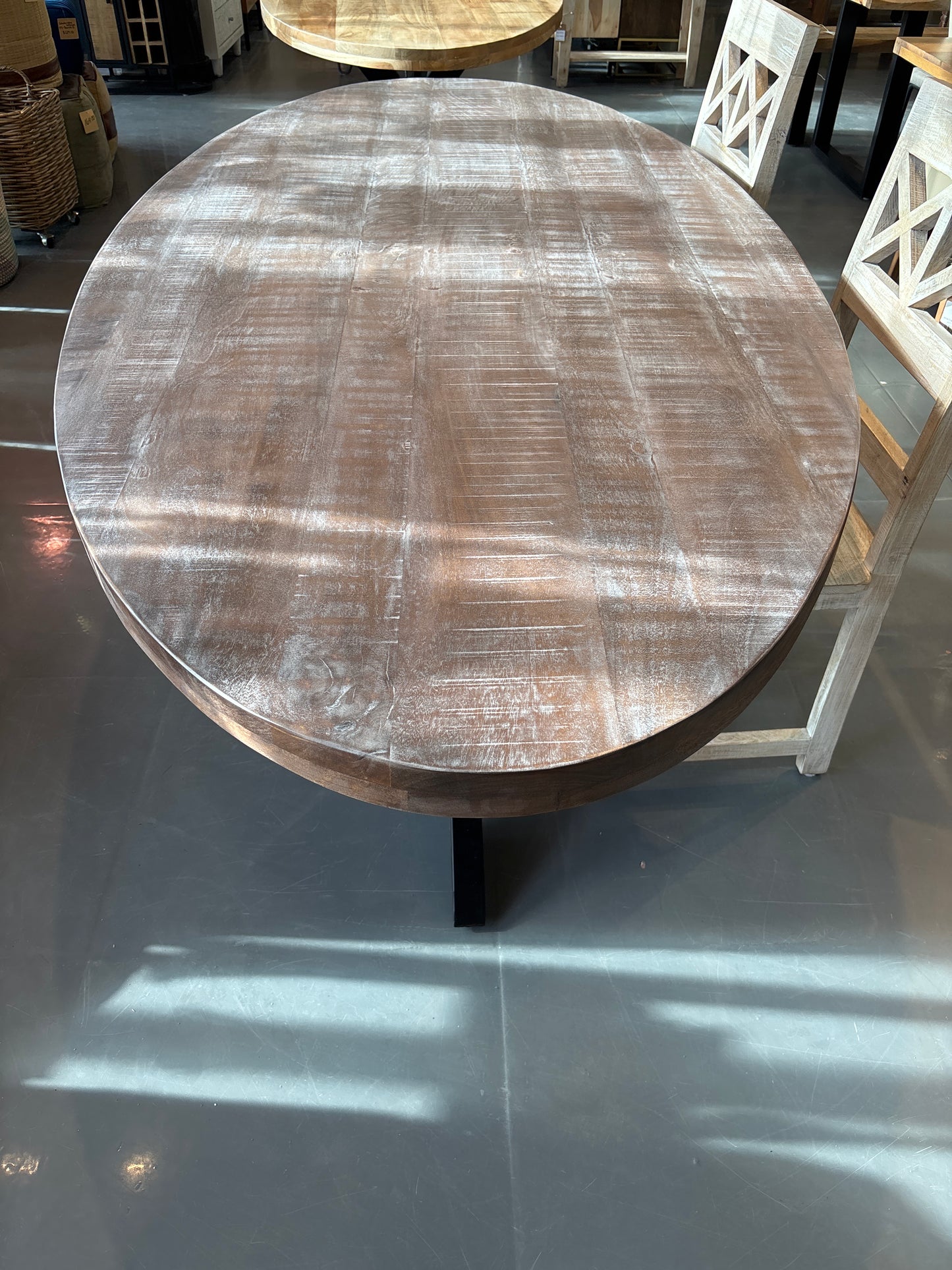 Cartier 91 inch Weathered Oval Mango wood dining table