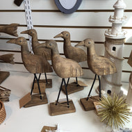 Decorative standing wooden bird with metal legs
