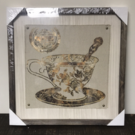 Framed tea cup print on material canvas